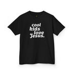 Black t-shirt with 'cool kids love Jesus' text design on a white background